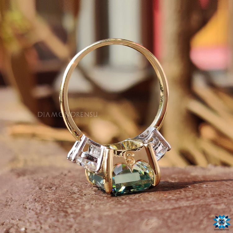 Custom radiant cut moissanite ring in two tone gold.