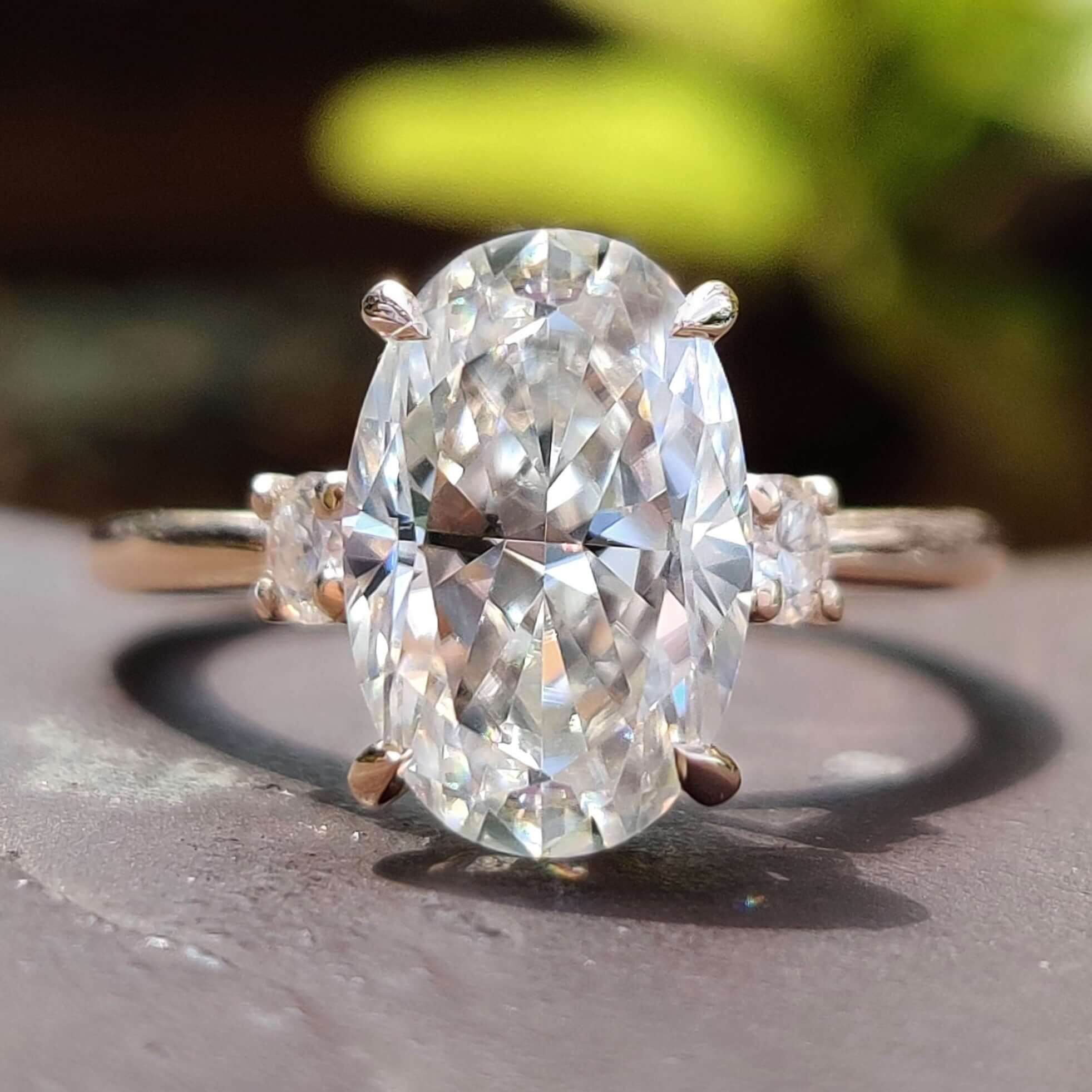 Hidden halo moissanite ring with oval cut center.