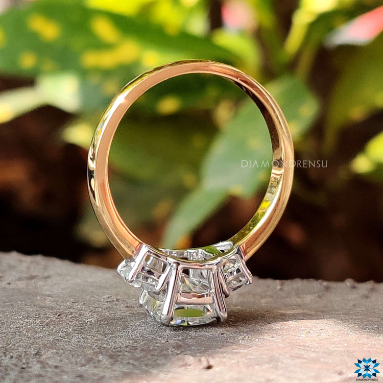 White and yellow gold moissanite engagement ring.