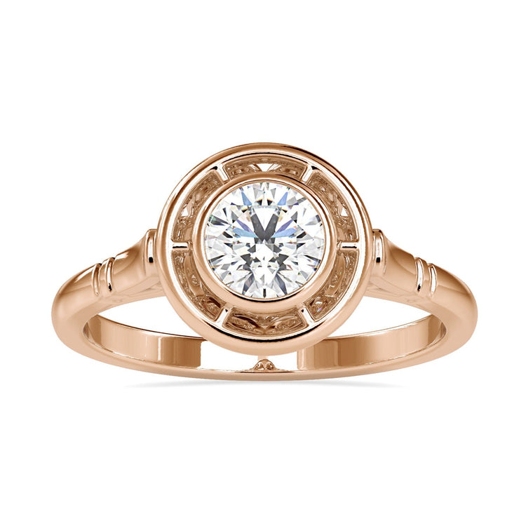 Bezel set engagement ring with round diamond in white gold.