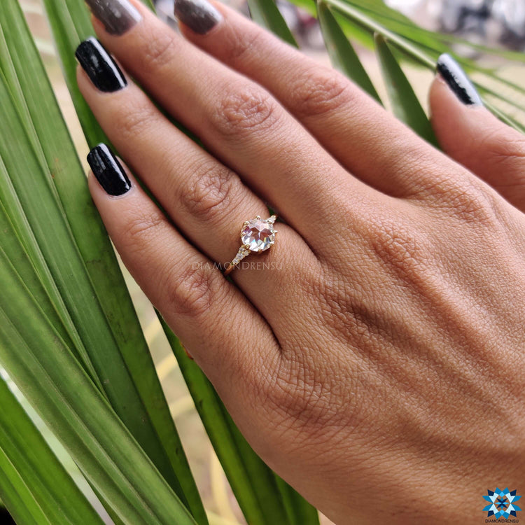 Handmade jewellery featuring a yellow gold muse setting and round stones.