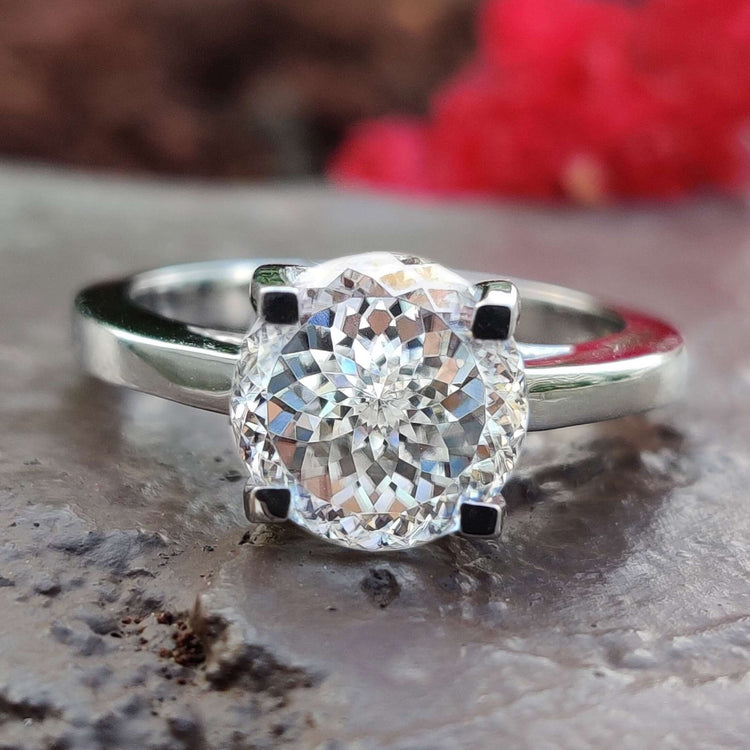 White gold solitaire ring with Portuguese cut moissanite.