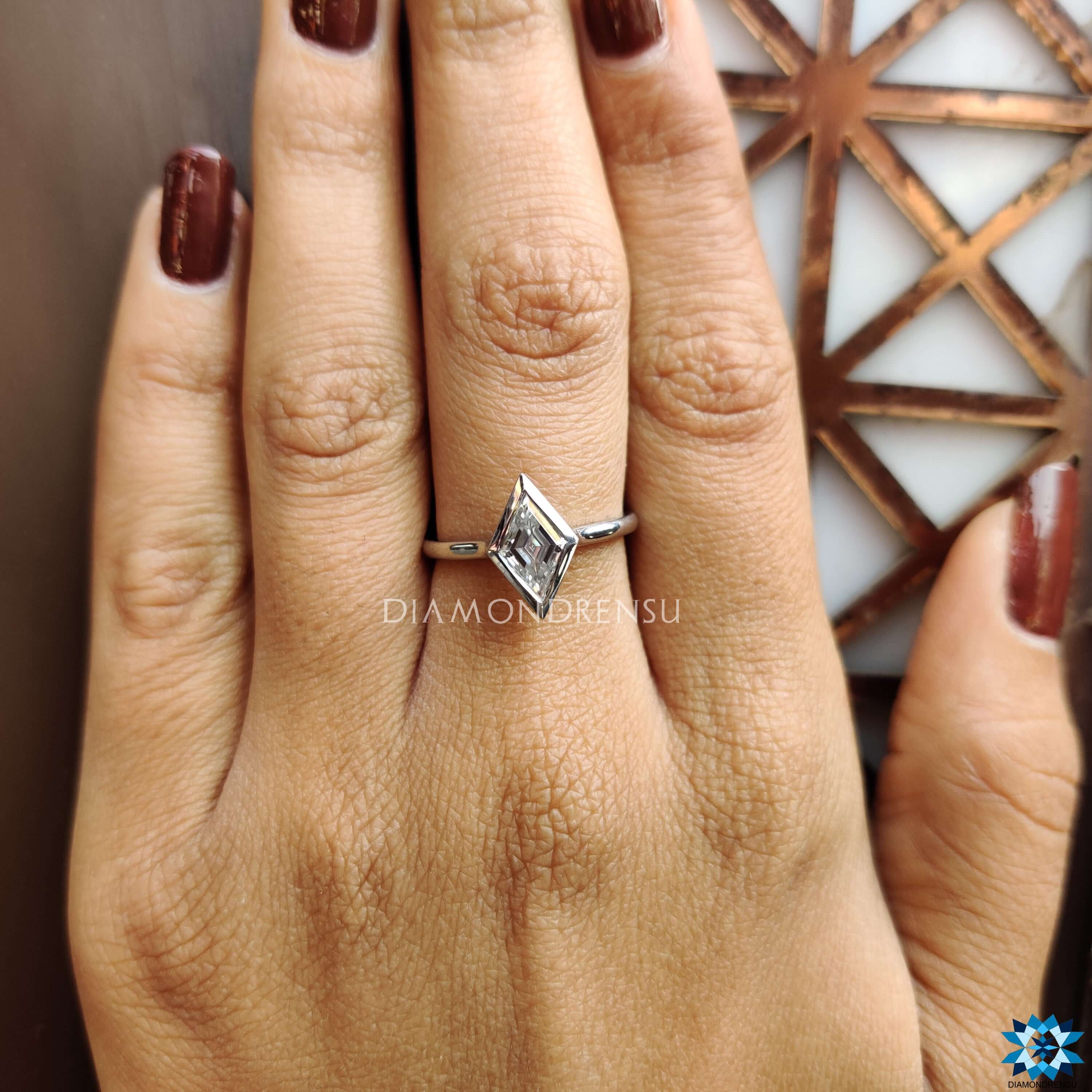 Handmade solitaire ring with bezel set moissanite stone.