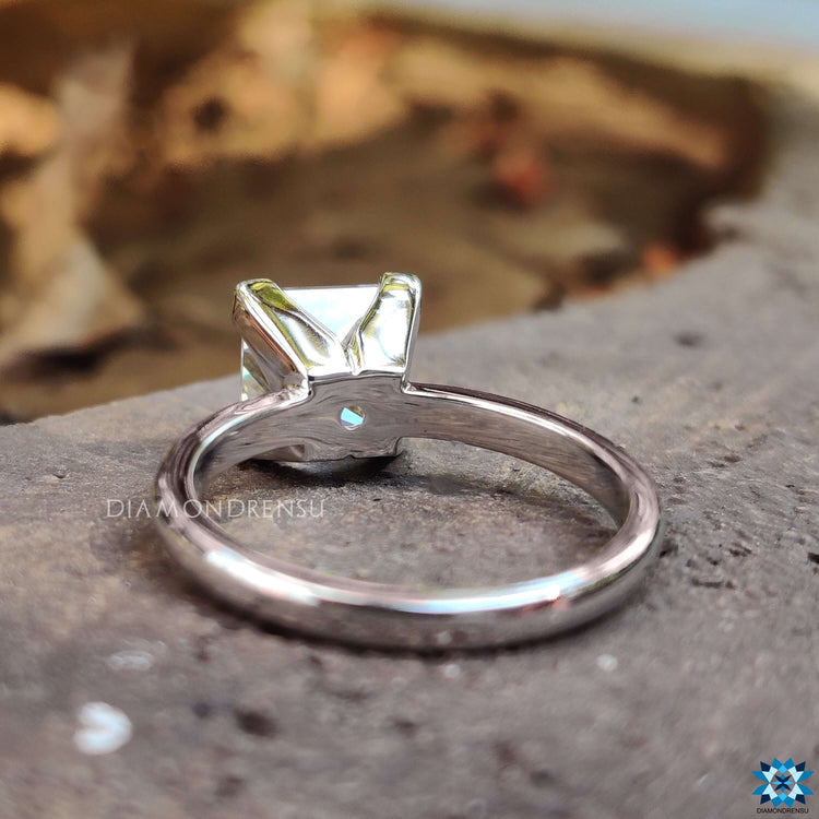 Custom white gold ring with princess cut moissanite.