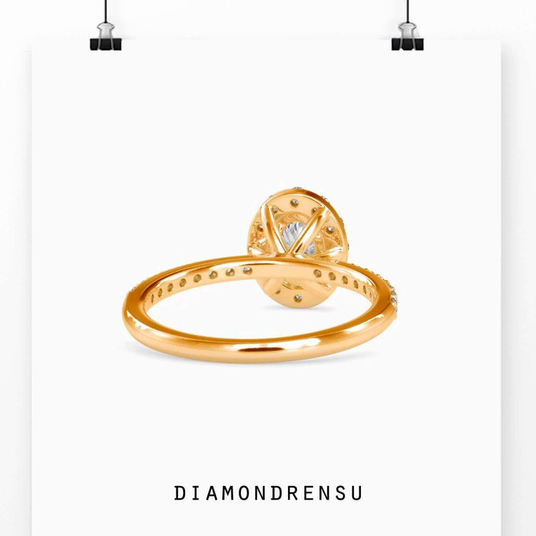 Lab grown diamond ring featuring oval cut and pave band.
