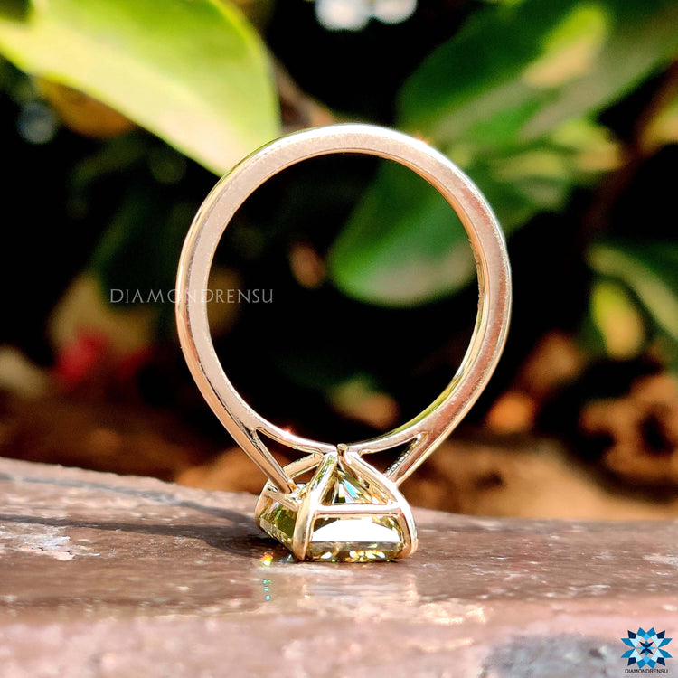 Radiant cut solitaire engagement ring in yellow gold.