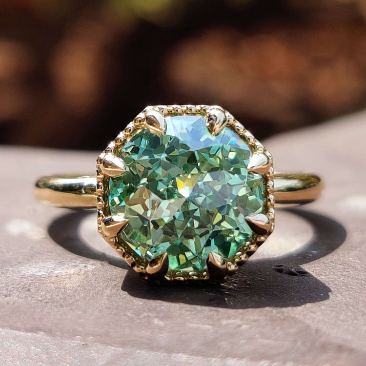 Jubilee ring with solitaire engagement design.