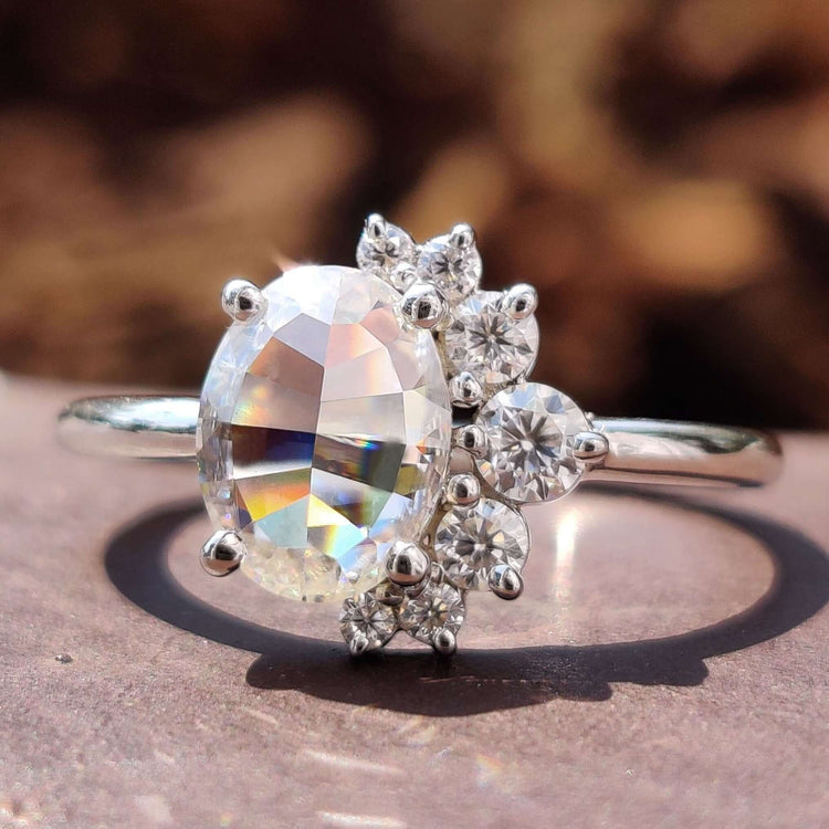 Gold oval engagement ring with rose cut moissanite.