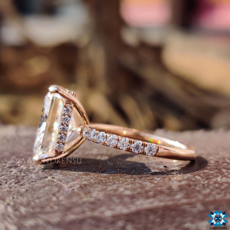 Radiant cut moissanite center stone in hidden halo ring.