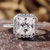 Halo engagement ring with radiant cut moissanite.