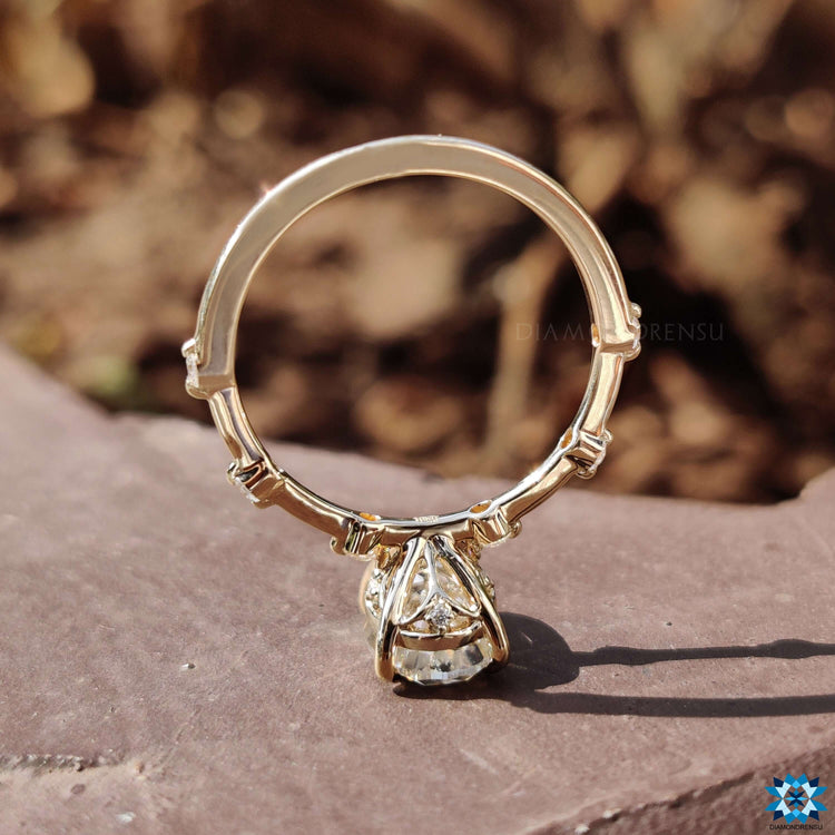 Distance pave ring with round cut pave band.