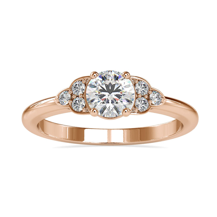 UK engagement ring in muse style with seven round diamonds.