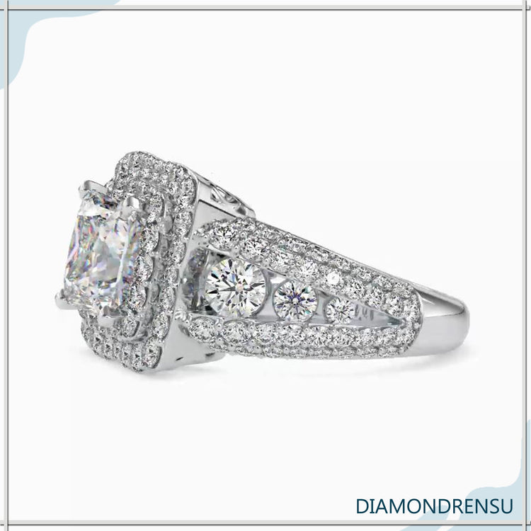 Split shank engagement ring with pave set diamonds.