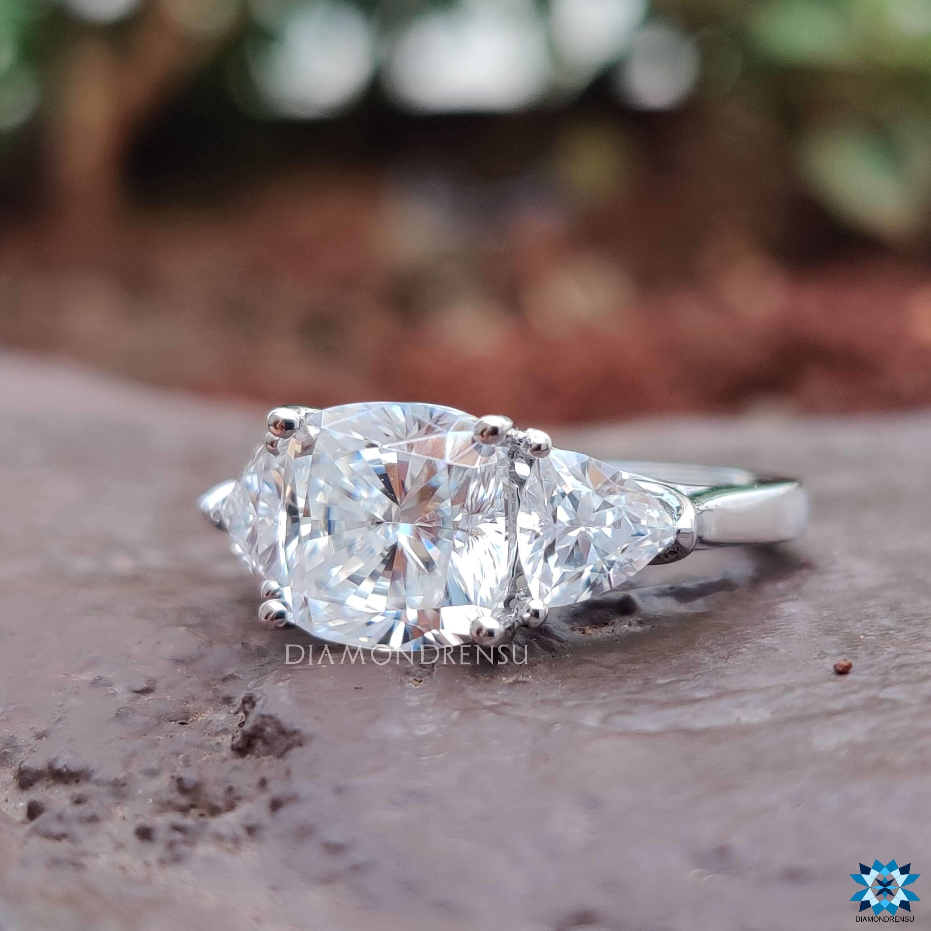 Moissanite engagement ring featuring a three-stone prong setting.