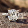 Hidden halo engagement ring with cushion divine cut stone.