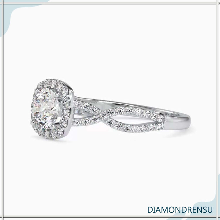 Twisted engagement ring with halo setting in rose or yellow gold.