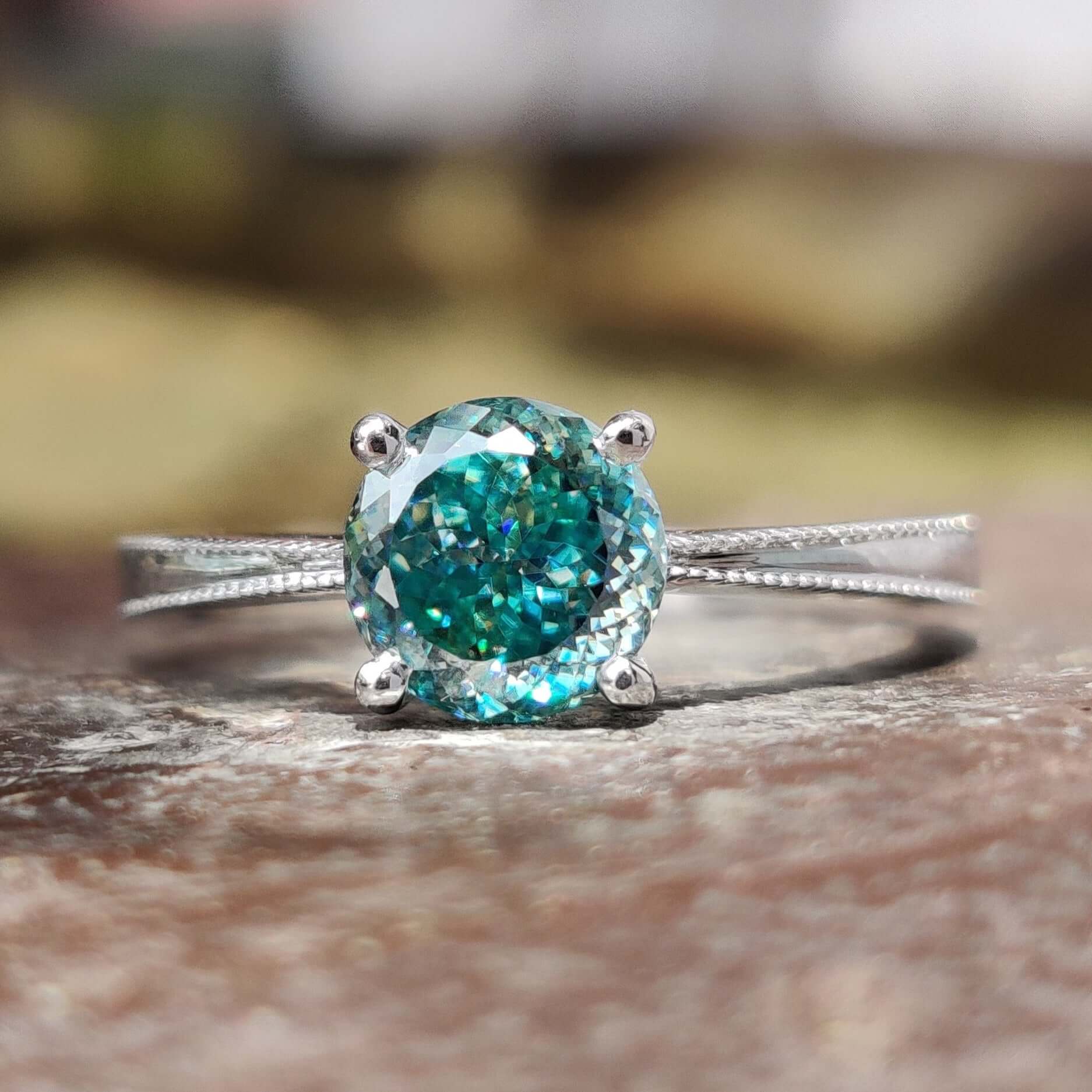Portuguese moissanite ring with tapered shank band.