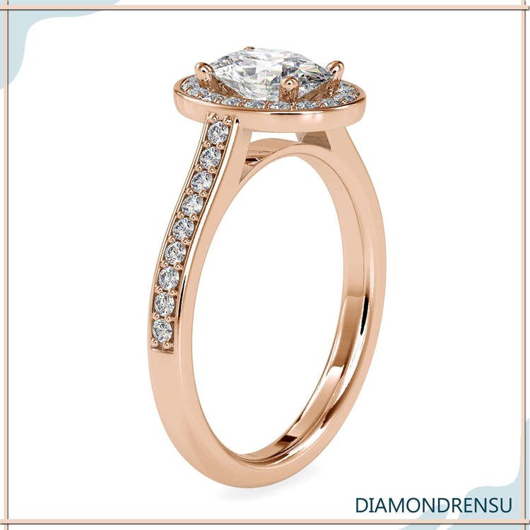 Round cut halo ring with 4 round prong setting in yellow gold.