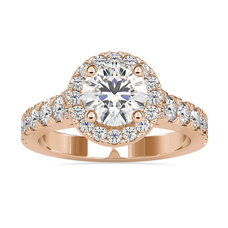Halo diamond ring with round cut centre in white gold.