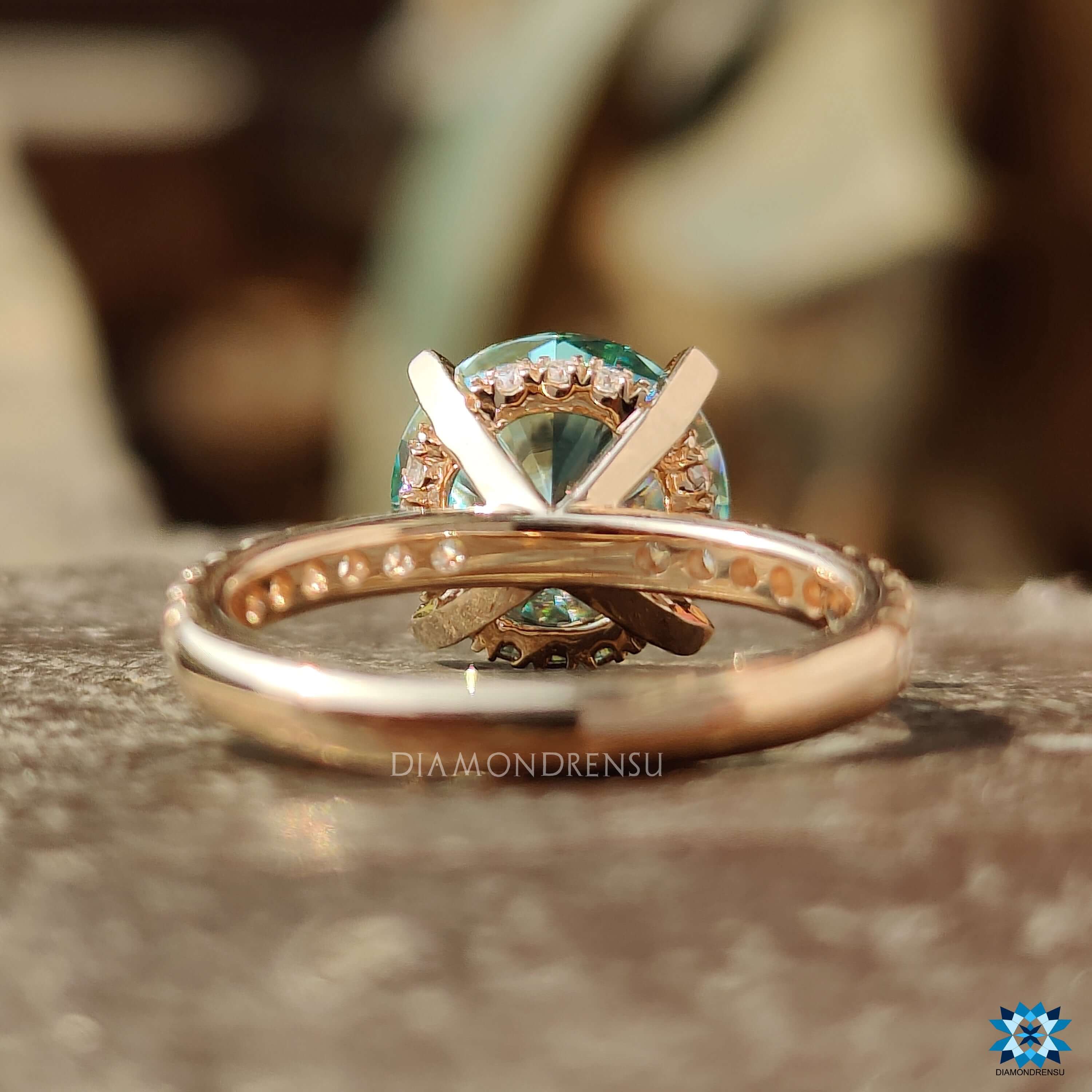 Four prong claw setting moissanite ring in rose gold.