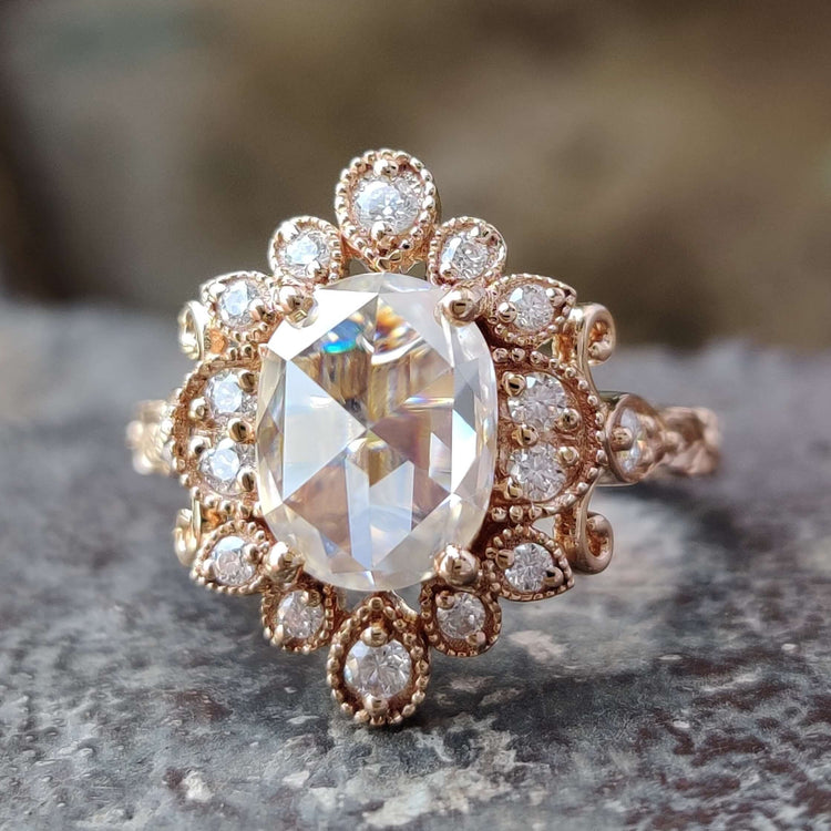 Vintage gold engagement ring with oval rose cut stone.