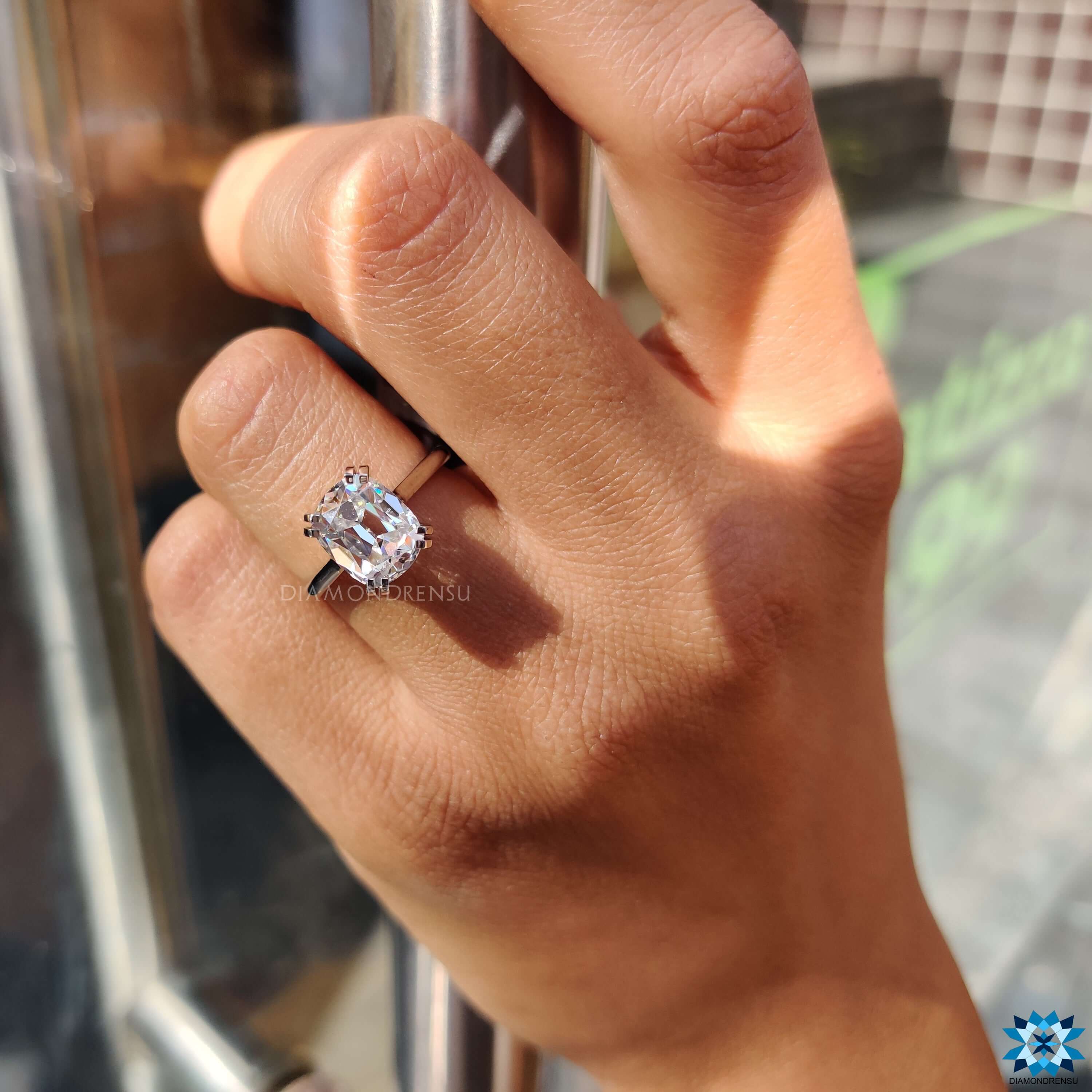 White gold solitaire ring with cushion old European cut stone.