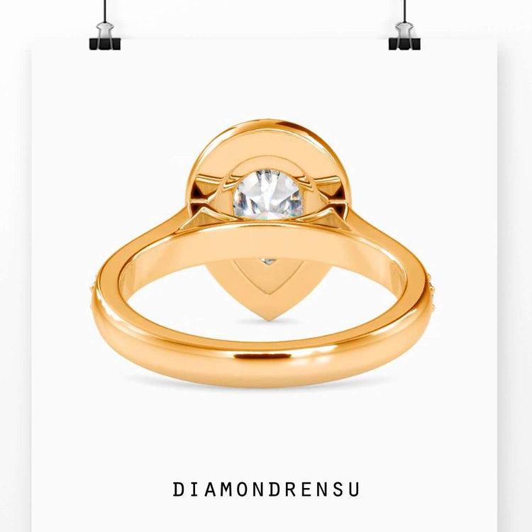 Simple diamond ring in white gold with round cut halo.