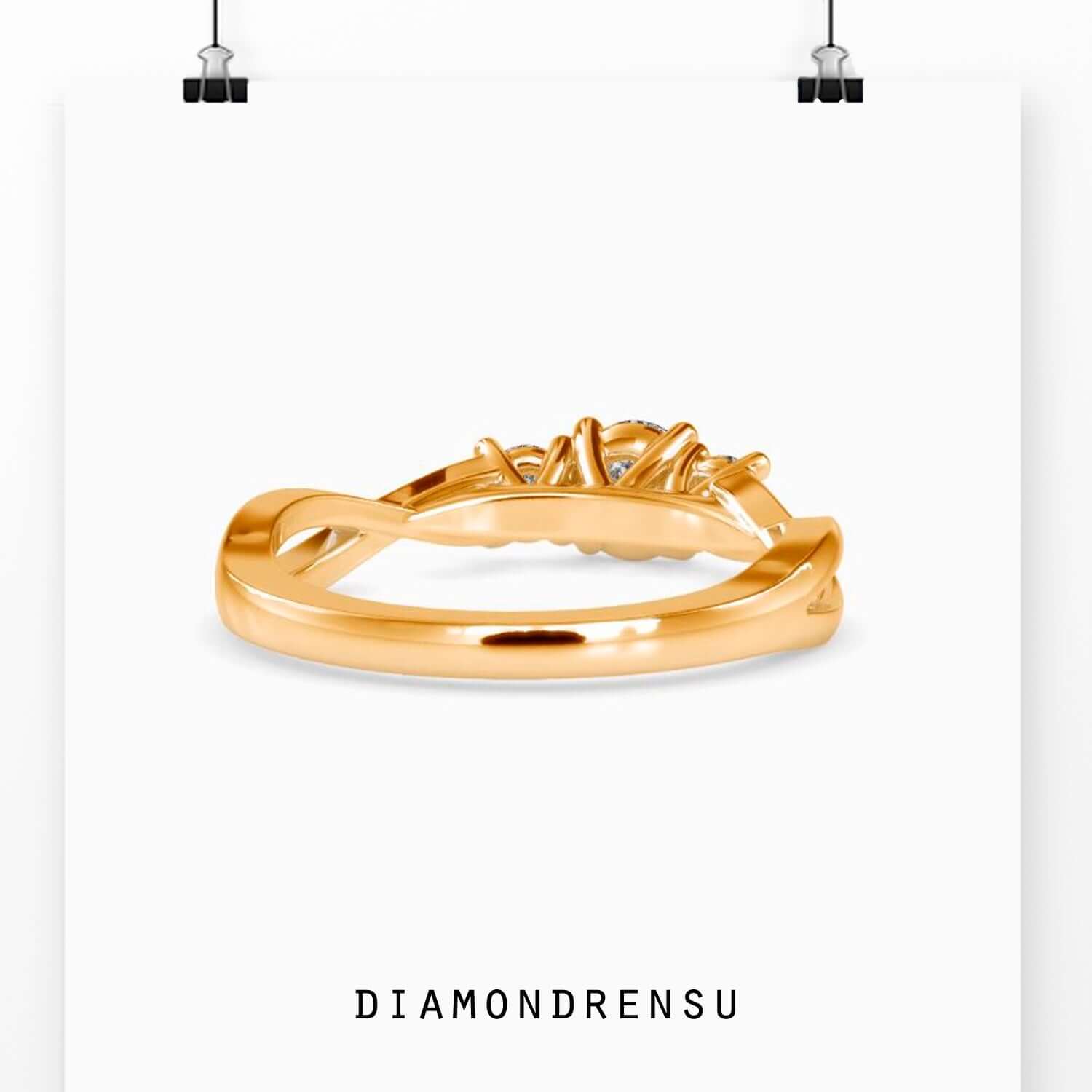 Handmade twisted engagement ring in rose gold with lab diamonds.