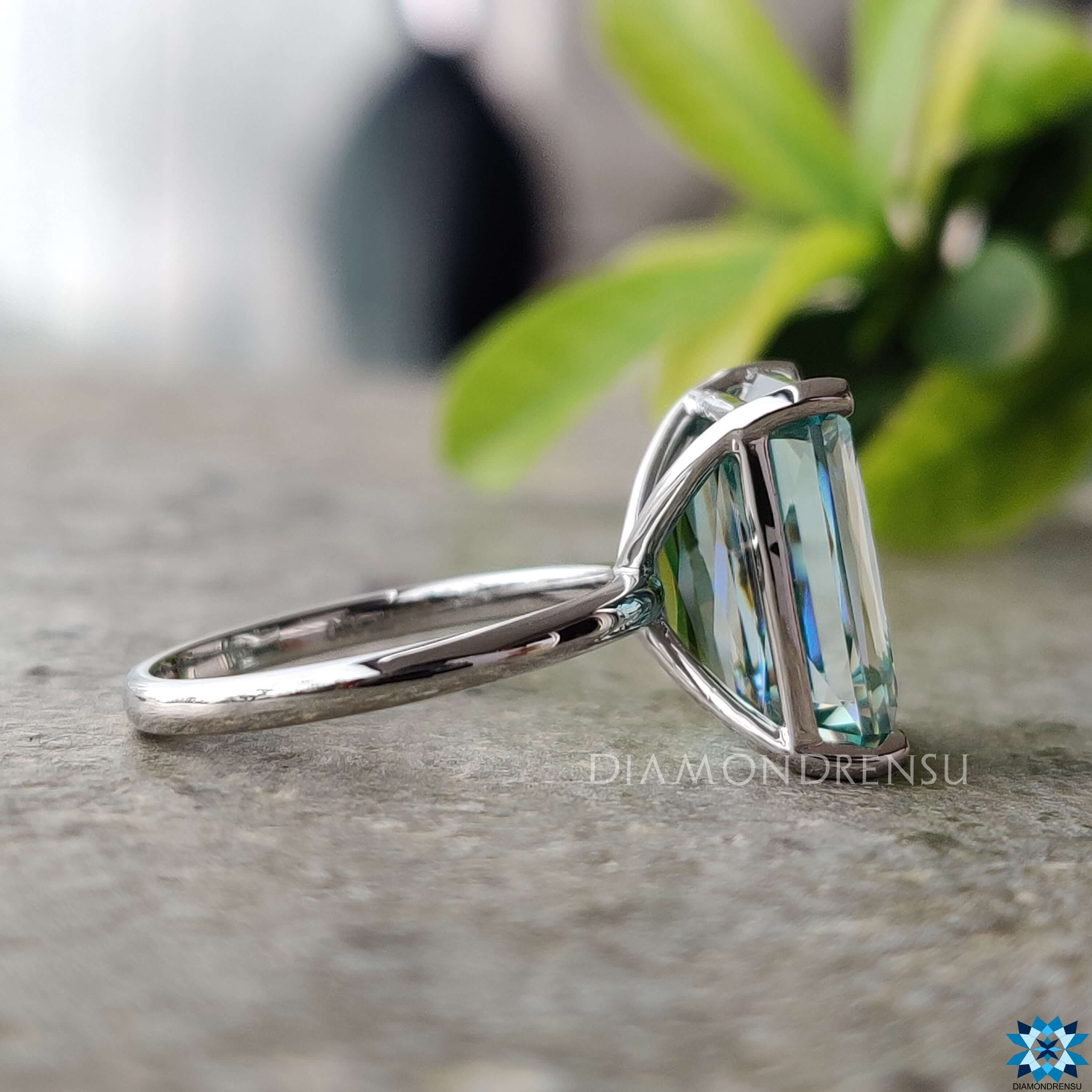 White gold moissanite ring with criss cut centre stone and 4 prong claw setting.