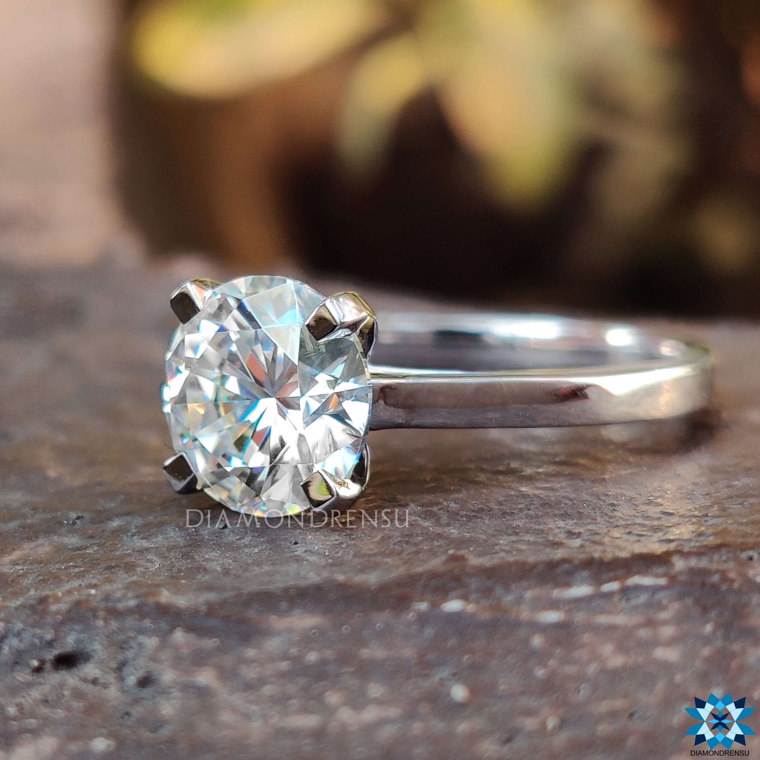 4 tab prong round moissanite ring.