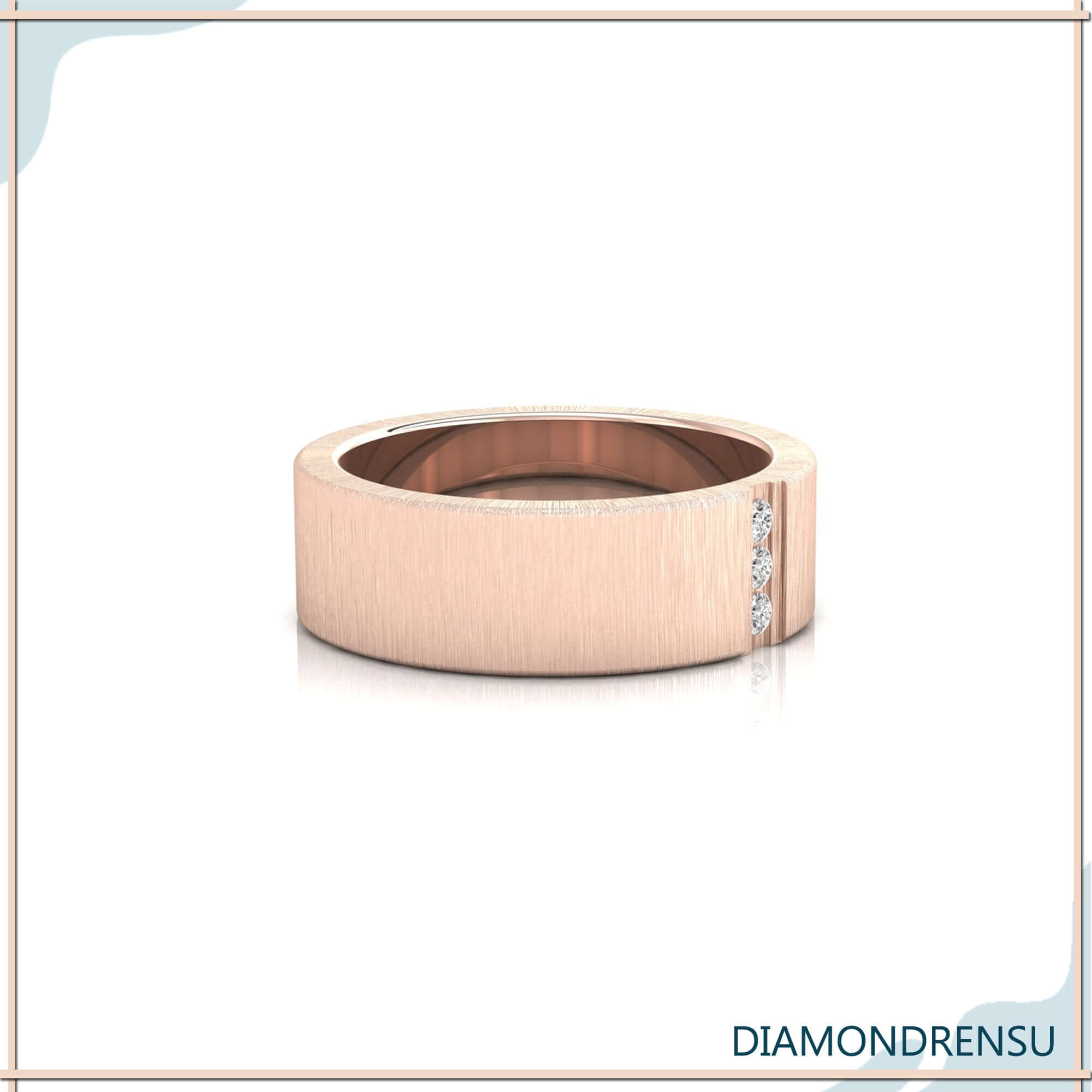 Three stone diamond wedding band in brushed finish with yellow gold.