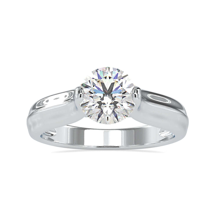 Simple diamond ring with round cut in unique tension setting.
