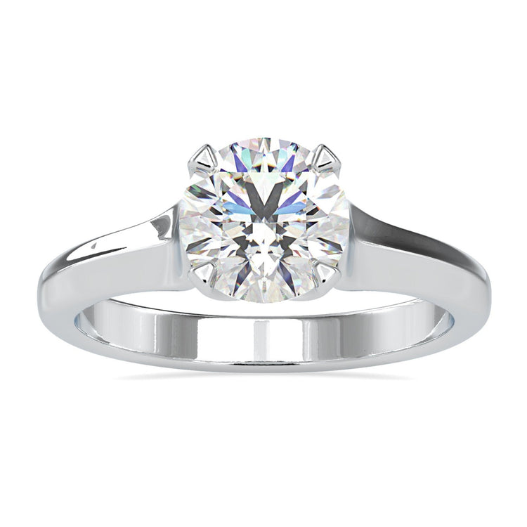 Gold solitaire diamond engagement ring with round cut diamond.