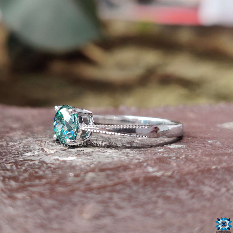 White gold ring with 4 prong setting.