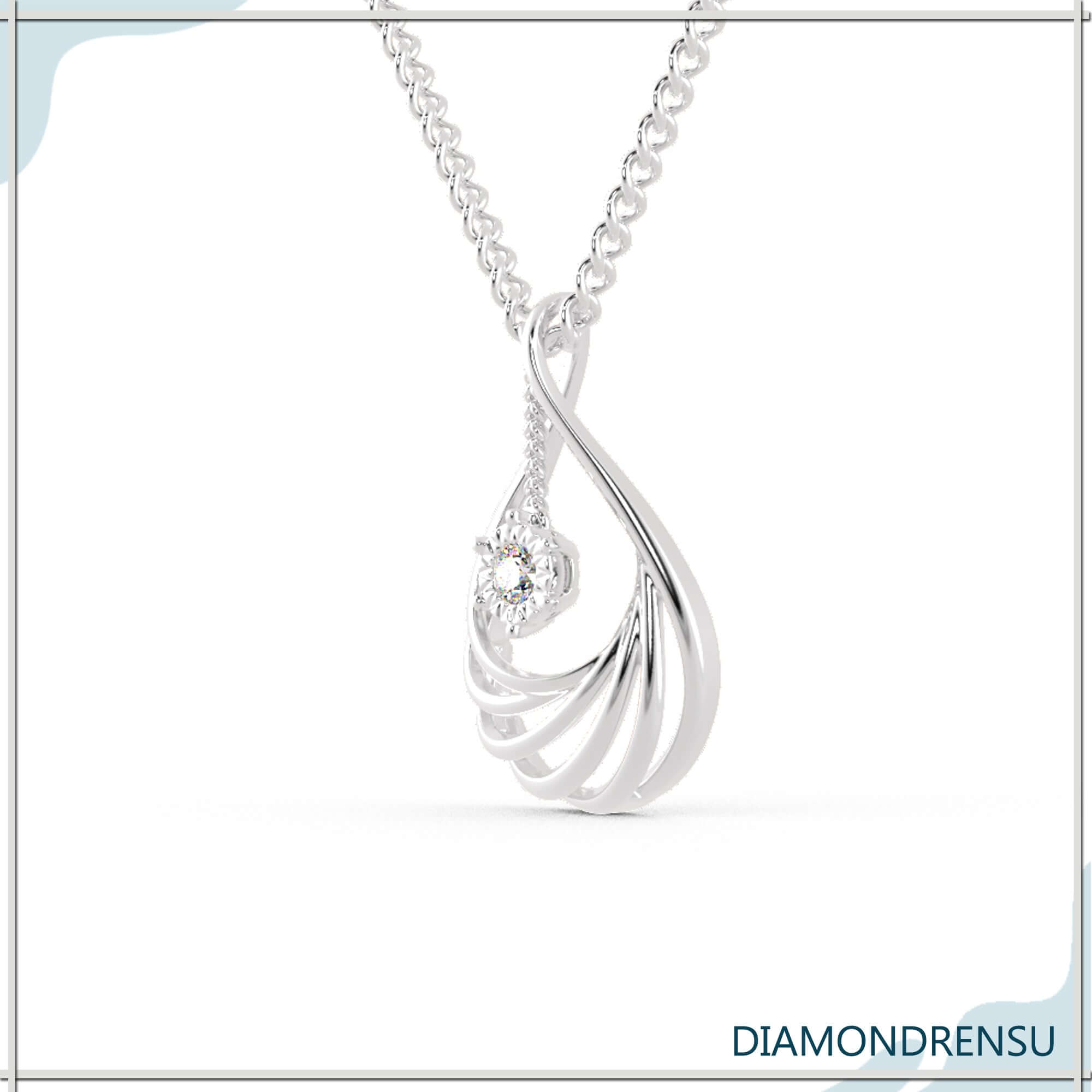 Diamondrensu UK teardrop pendant with round centre and halo.
