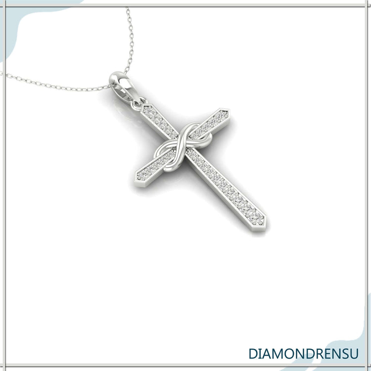 Handmade jewellery pendant with infinity cross design.