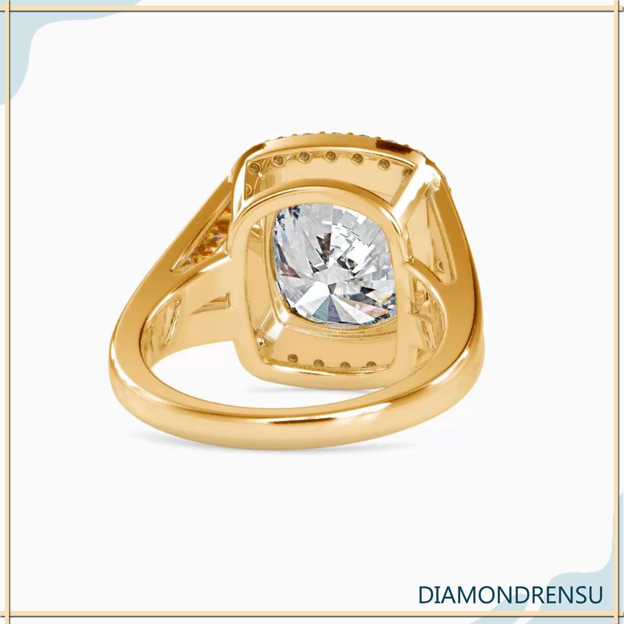 Rose gold halo engagement ring with cushion lab diamond.