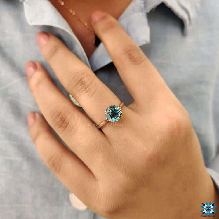 Cathedral setting tulip engagement ring with blue moissanite.