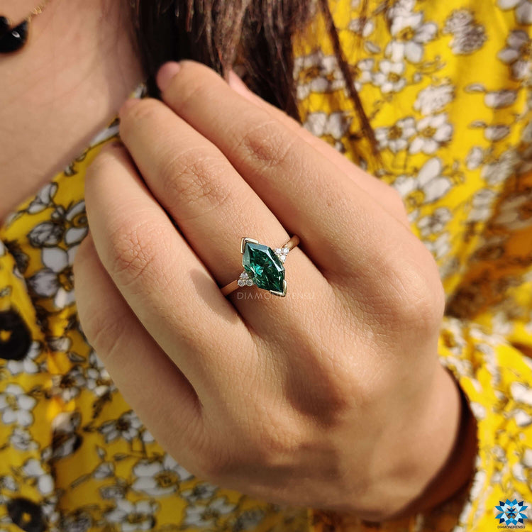 Elegant yellow gold ring with Dutch marquise cut moissanite.