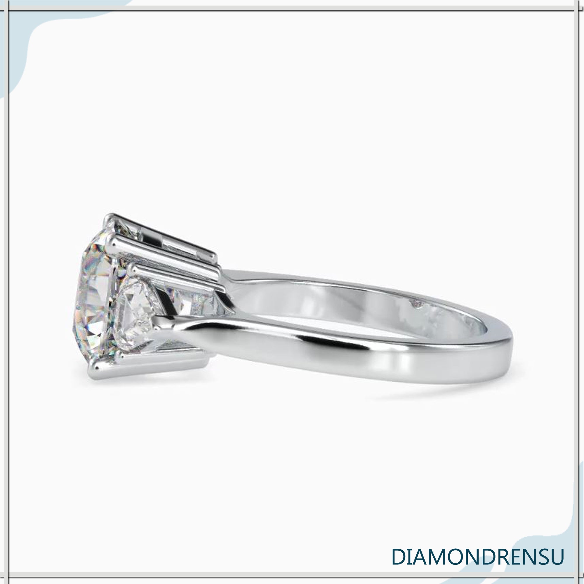 Buy engagement ring with three stone layout in yellow gold.