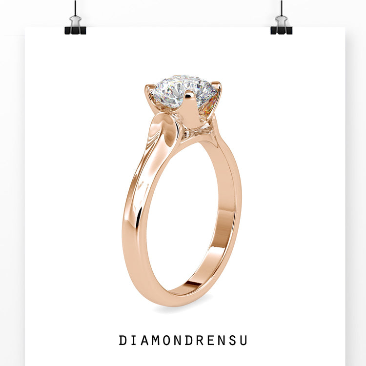 Handmade ring in yellow gold with round cut solitaire.