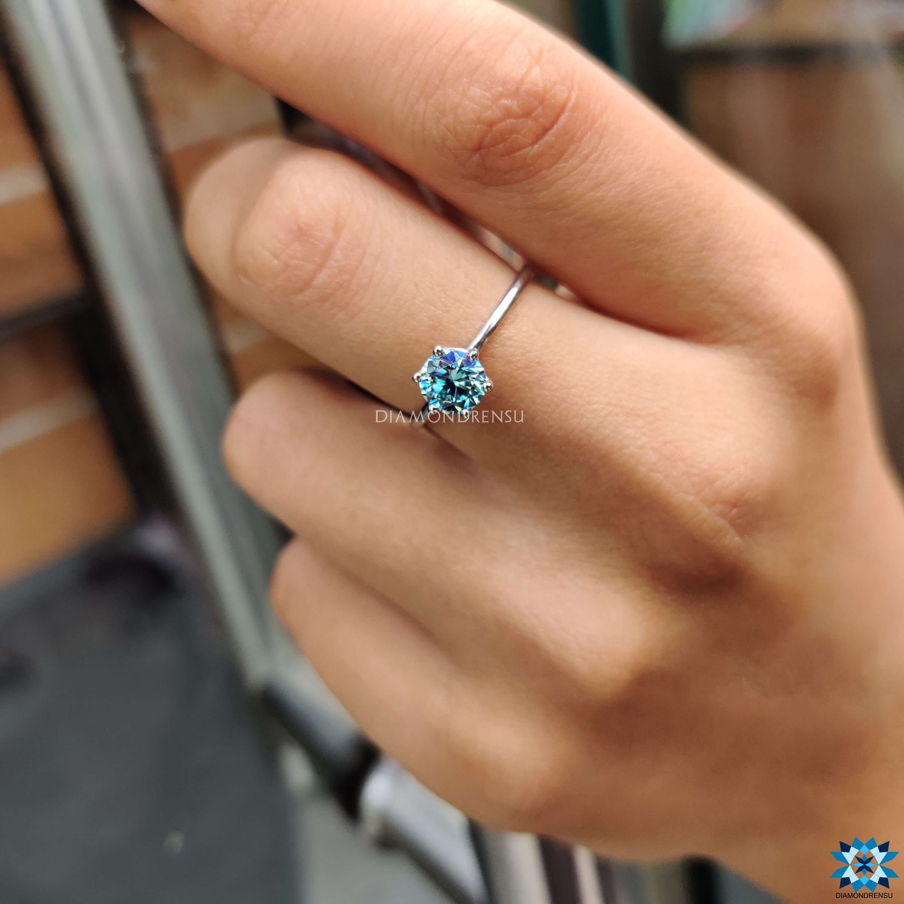 Six prong moissanite engagement ring in white gold.