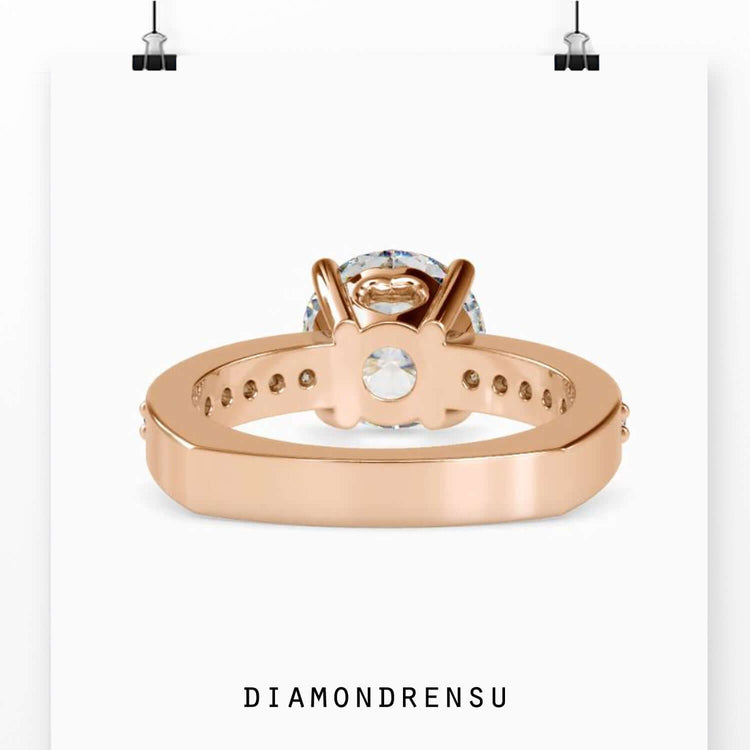 Lab grown diamond in a basket prong setting on a designer ring band.