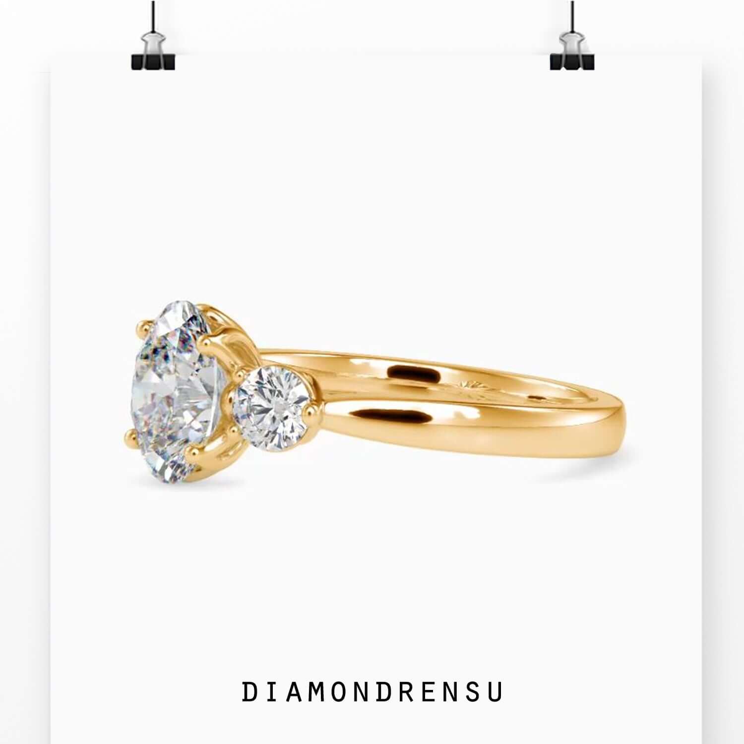 Yellow gold three stone diamond engagement ring.
