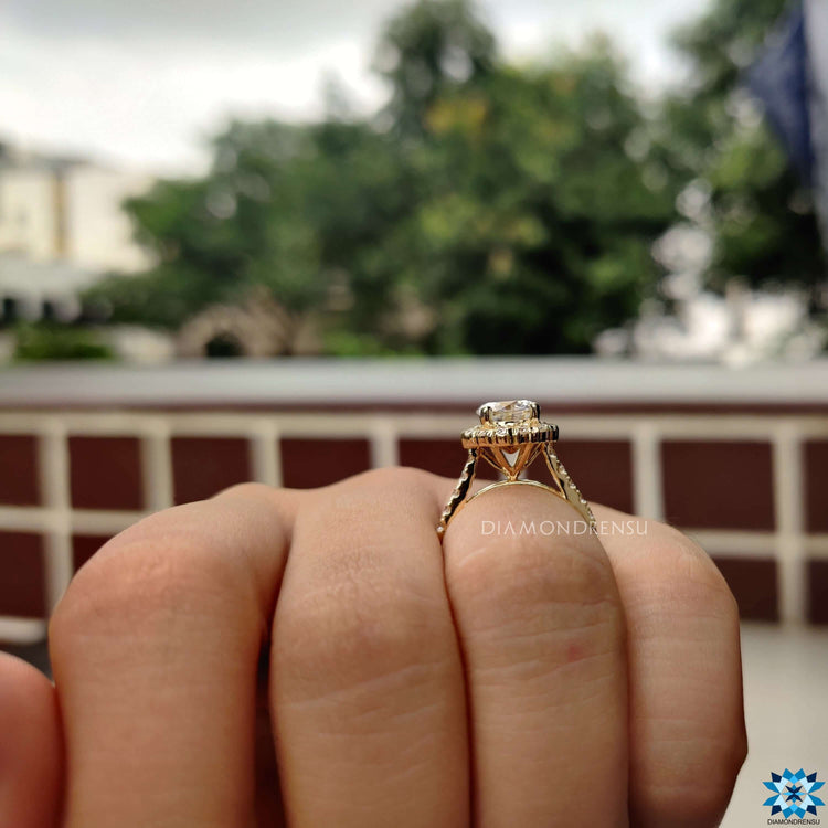 Pave set halo engagement ring with round center stone.