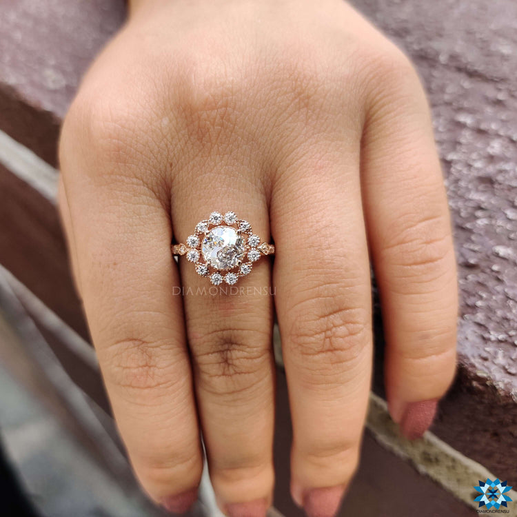 Buy moissanite ring with round cut and side stones.