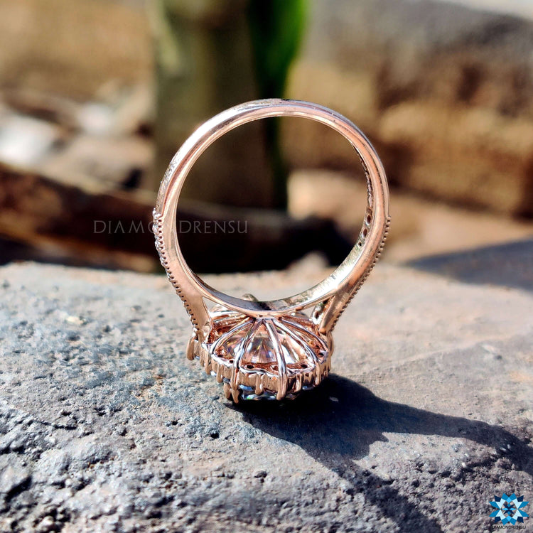 Custom engagement ring in rose gold with halo.