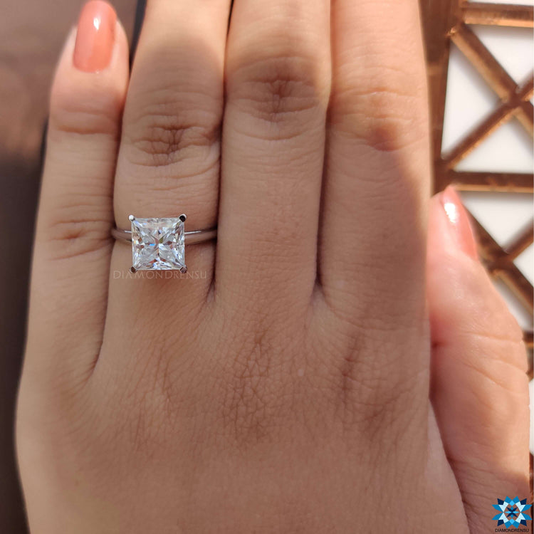 Princess cut engagement ring handcrafted in a solitaire design for a clean, modern look.