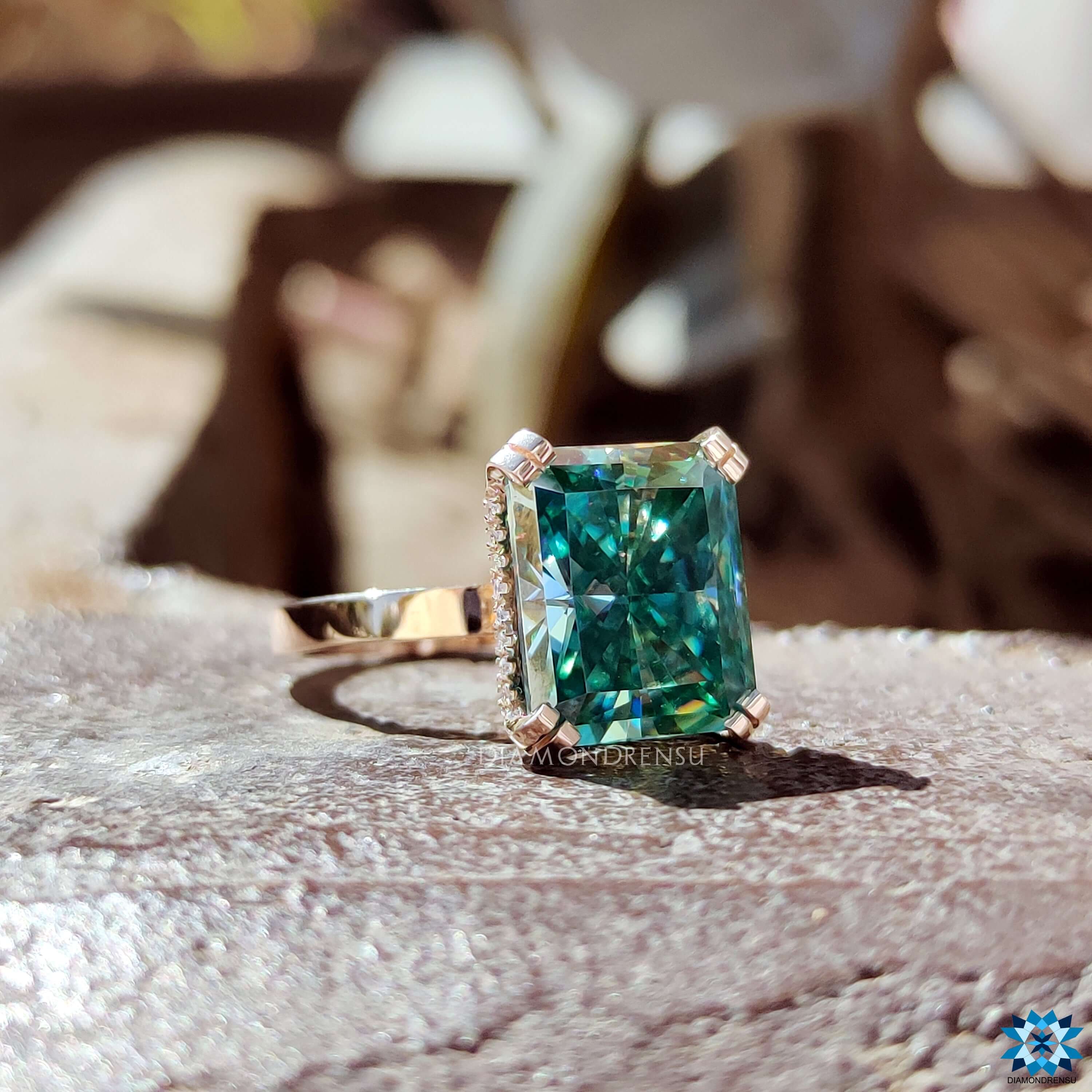Handmade rose gold engagement ring with radiant center.
