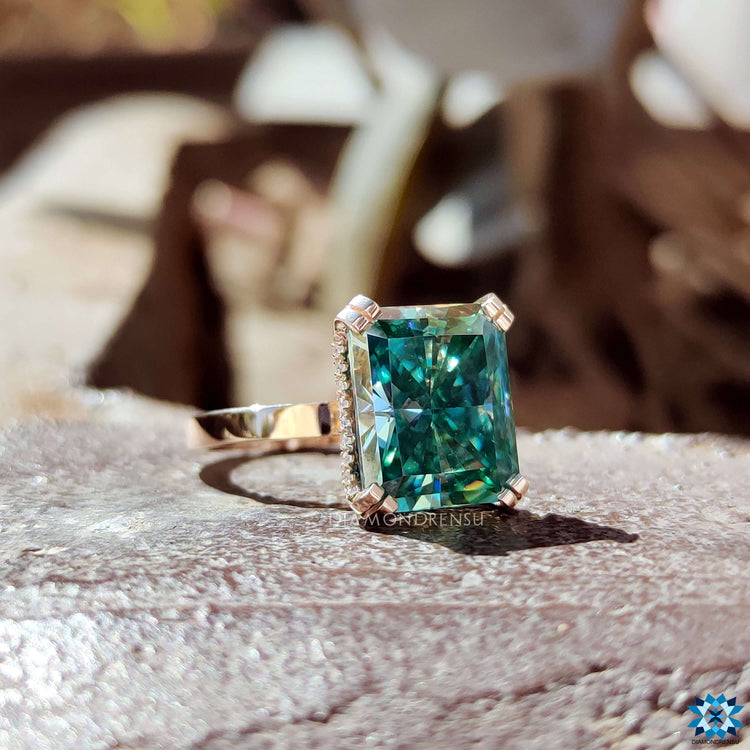 Handmade rose gold engagement ring with radiant center.